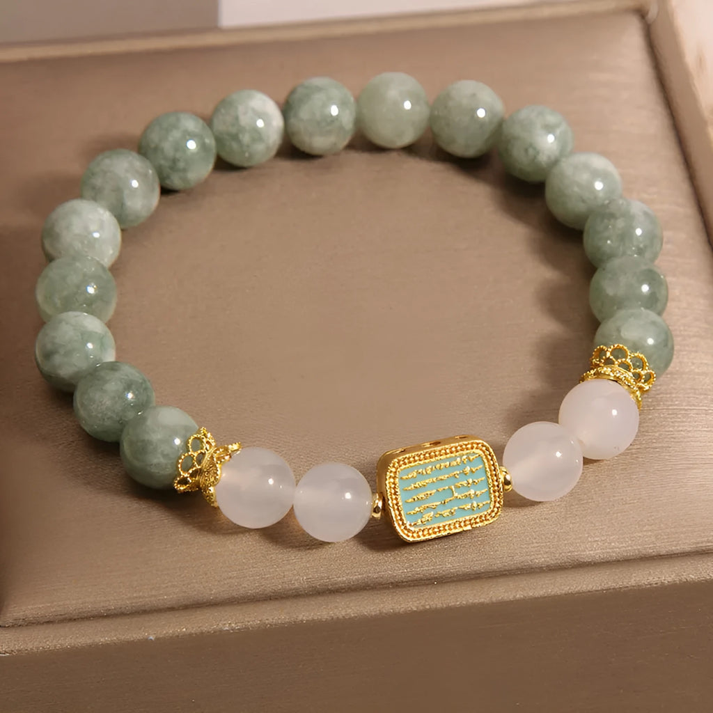 Oil green emerald crystal bracelet with five engraved Buddhist scripture beads on female wrist