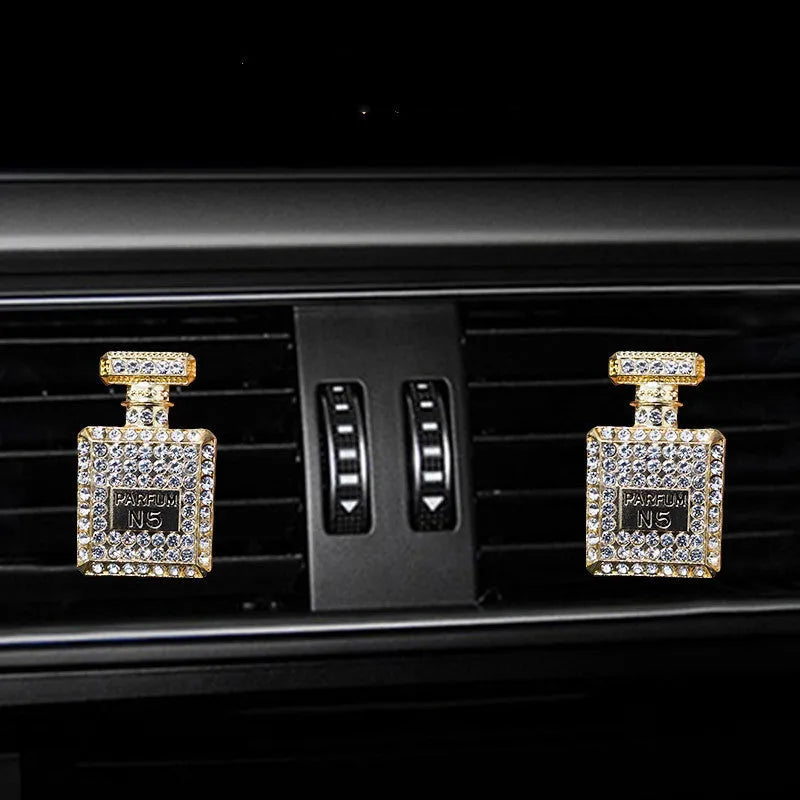 Gold alloy car air freshener holder in perfume bottle style, approx. 4.7cm x 3cm, for fragrance tablets