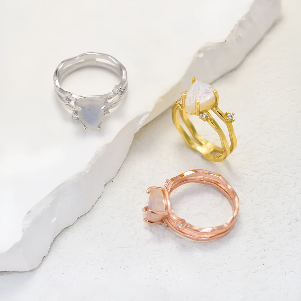 S925 sterling silver geometric ring with irregular triangle shape and moonstone detail in gold tone finish