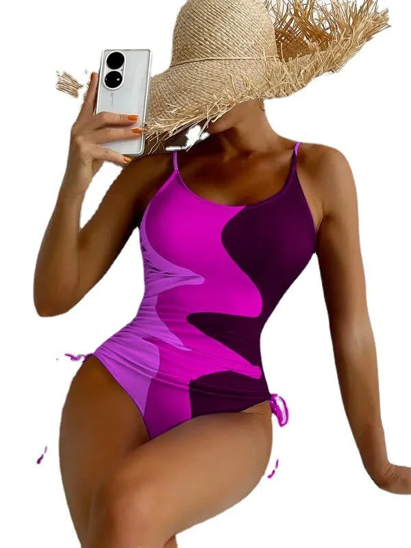 Women's blue one-piece swimsuit with sleeveless design and fixed swimming trunks