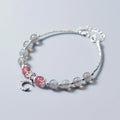 Handmade silver-toned bracelet with a blue-grey 6mm moonstone bead, small crescent moon charm, and clear crystal on an adjustable chain.