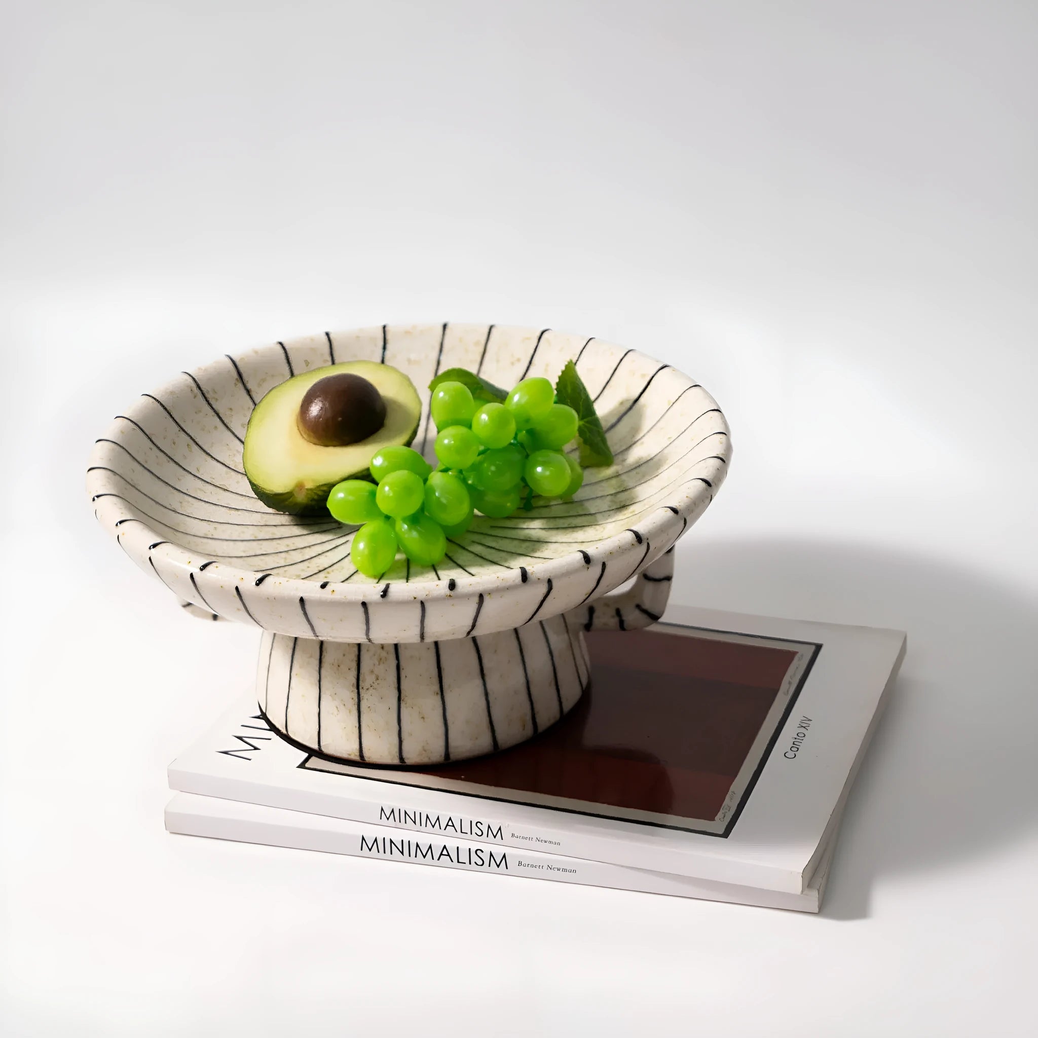 Black and white striped retro resin fruit plate on a table.