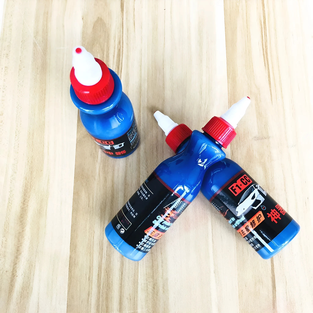 Automobile scratch repair kit with blue wiping tool and repair agent bottle for car paint restoration