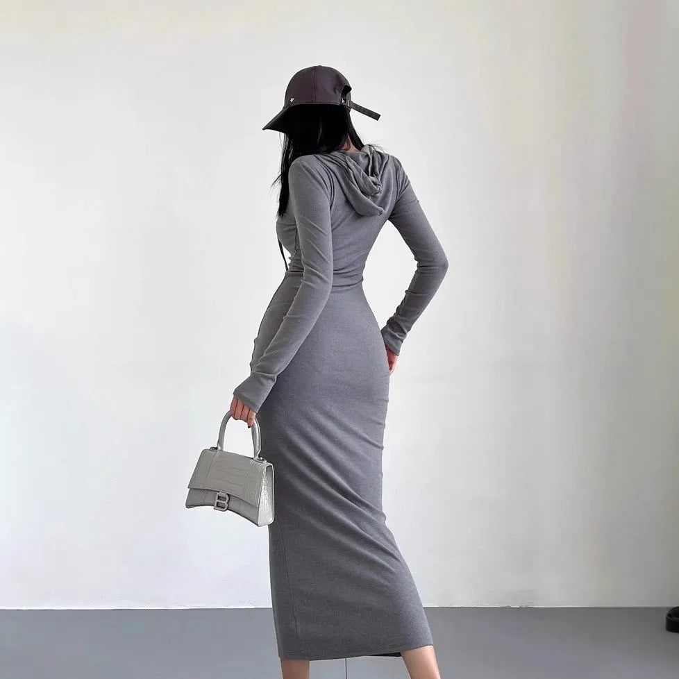A woman's long sleeve hooded sheath dress in polyester, showing the high waist and over-the-knee length.