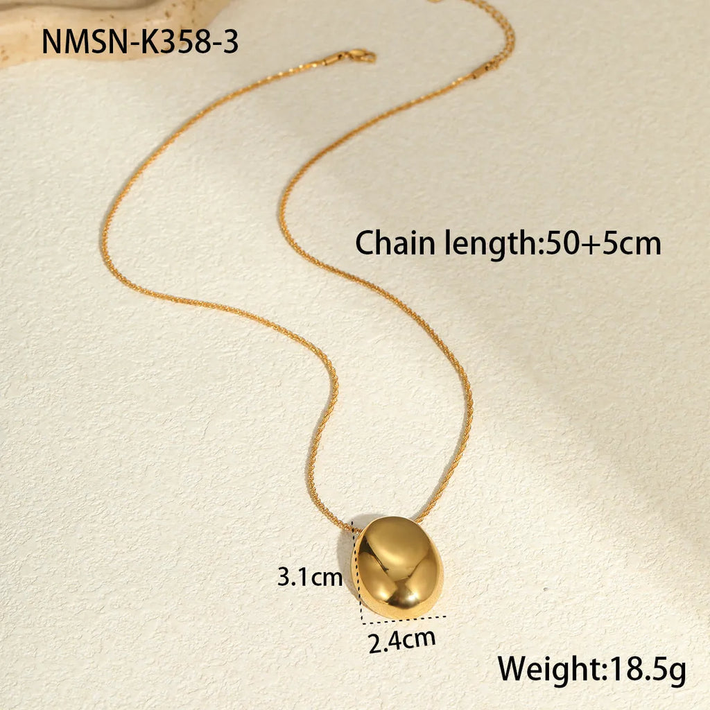 Gold-plated geometric pendant necklace with adjustable chain on model