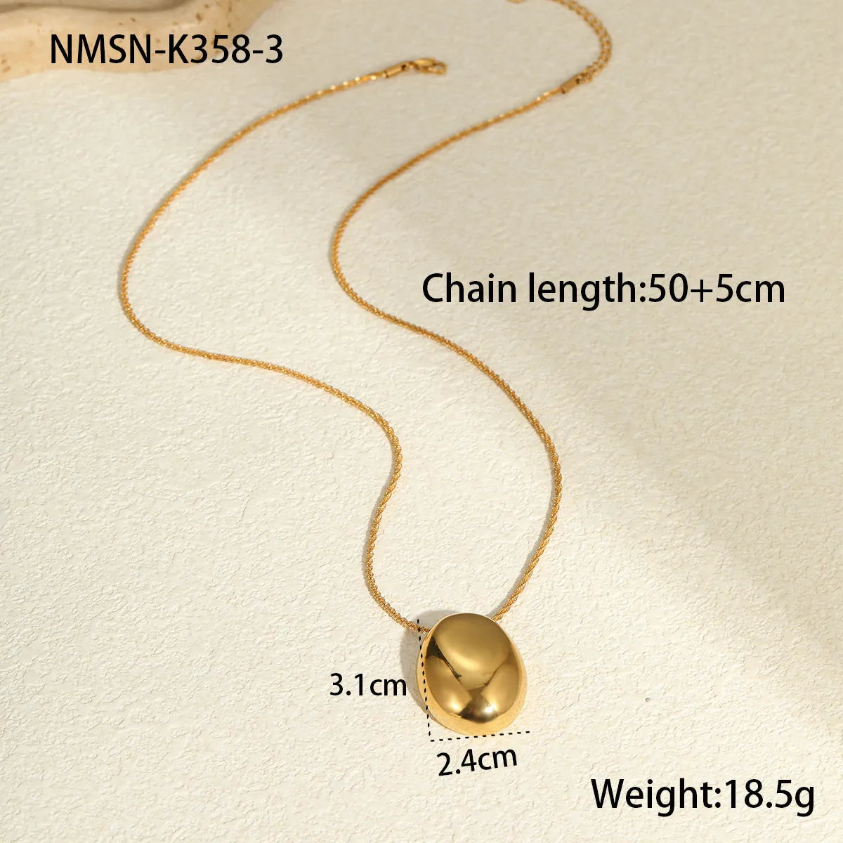 Gold-plated geometric pendant necklace with adjustable chain on model