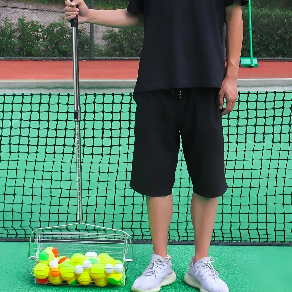 Stainless steel manual roller tennis ball picker for collecting 30 or 60 balls on court.