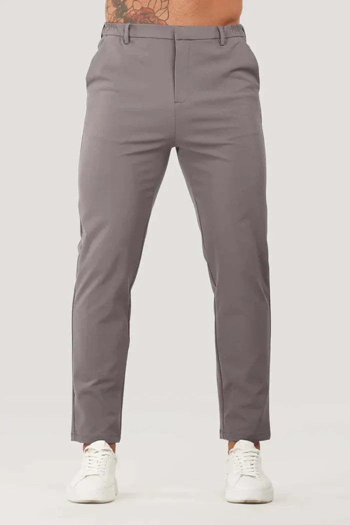 Men's solid colour suit trousers in mid waist, straight leg, small feet opening, polyester blend, available in five colours.