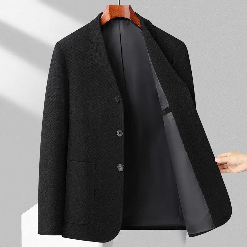 Men's loose fit solid colour wool-blend coat in black, shown on a model.