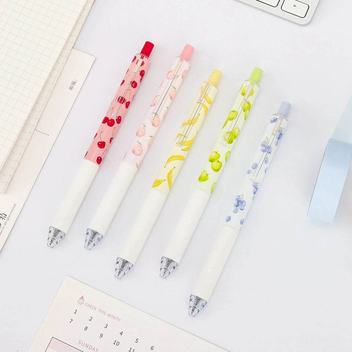 Three fruit scented pressurised pens with 0.5mm black ink and press-action mechanism