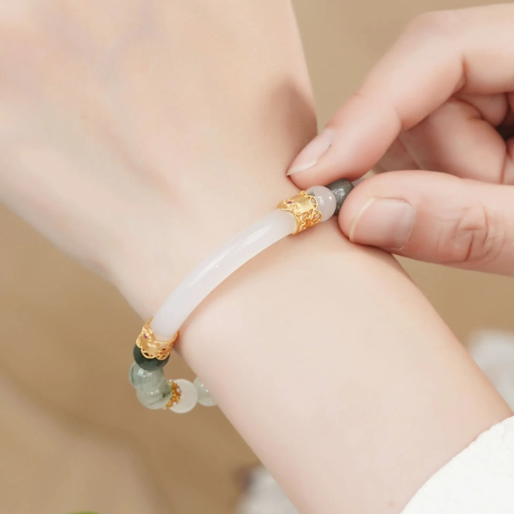 Emerald Green Tian Shan Cui women's bracelet with round beads in a Chinese national style.