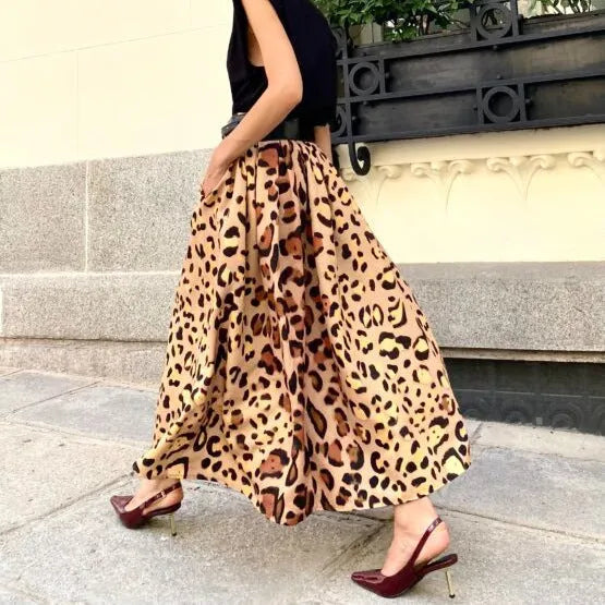 Women's brown leopard print A-line long skirt with big hem detail and animal pattern design