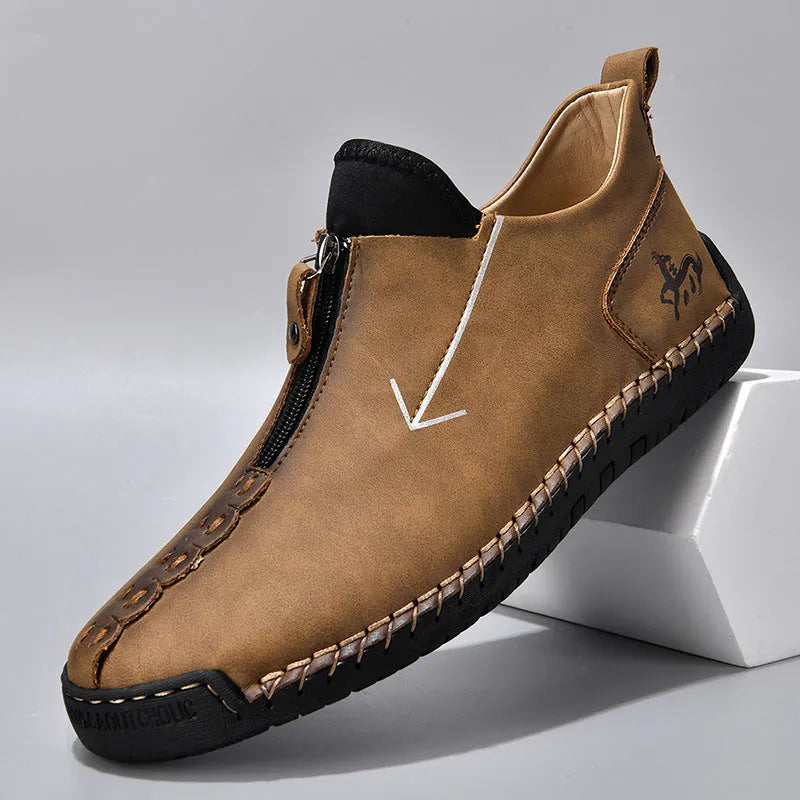 Men's black leather martin boots with front zipper and round toe design on rubber sole