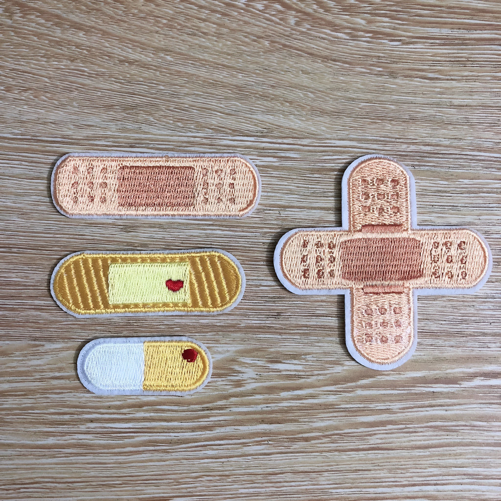 Computer embroidered fabric patch badges with lace craft design on white background