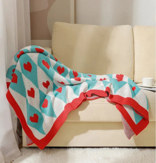 Bohemian-style acrylic sofa cover blanket with tassel trim in a geometric pattern colour option