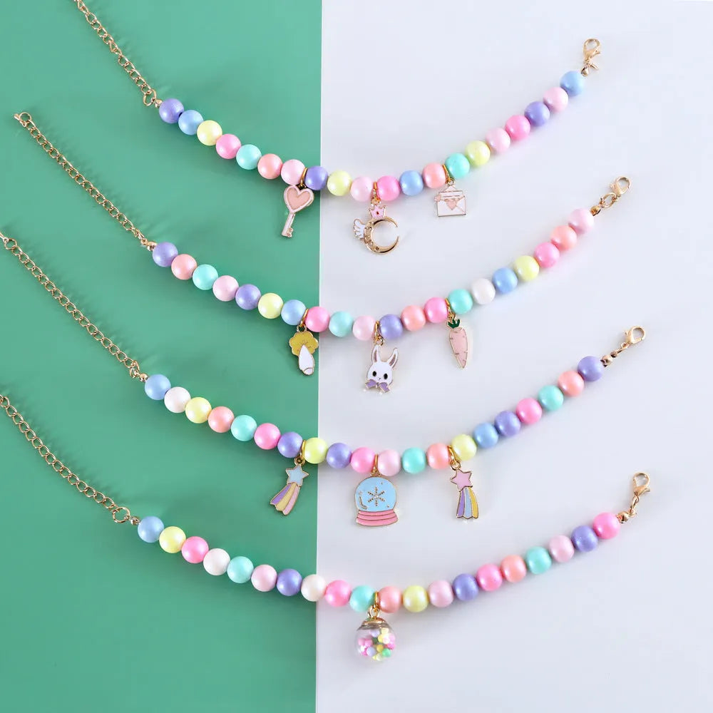 Macaron-colour resin collar and bracelet set for a small dog, showing the matching necklace.