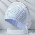 Adult solid colour silicone swimming cap with water drop design shown in multiple colour options.