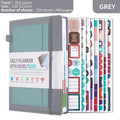 Undated A5 notebook with strap in purple PU cover, showing thread binding and closed with strap