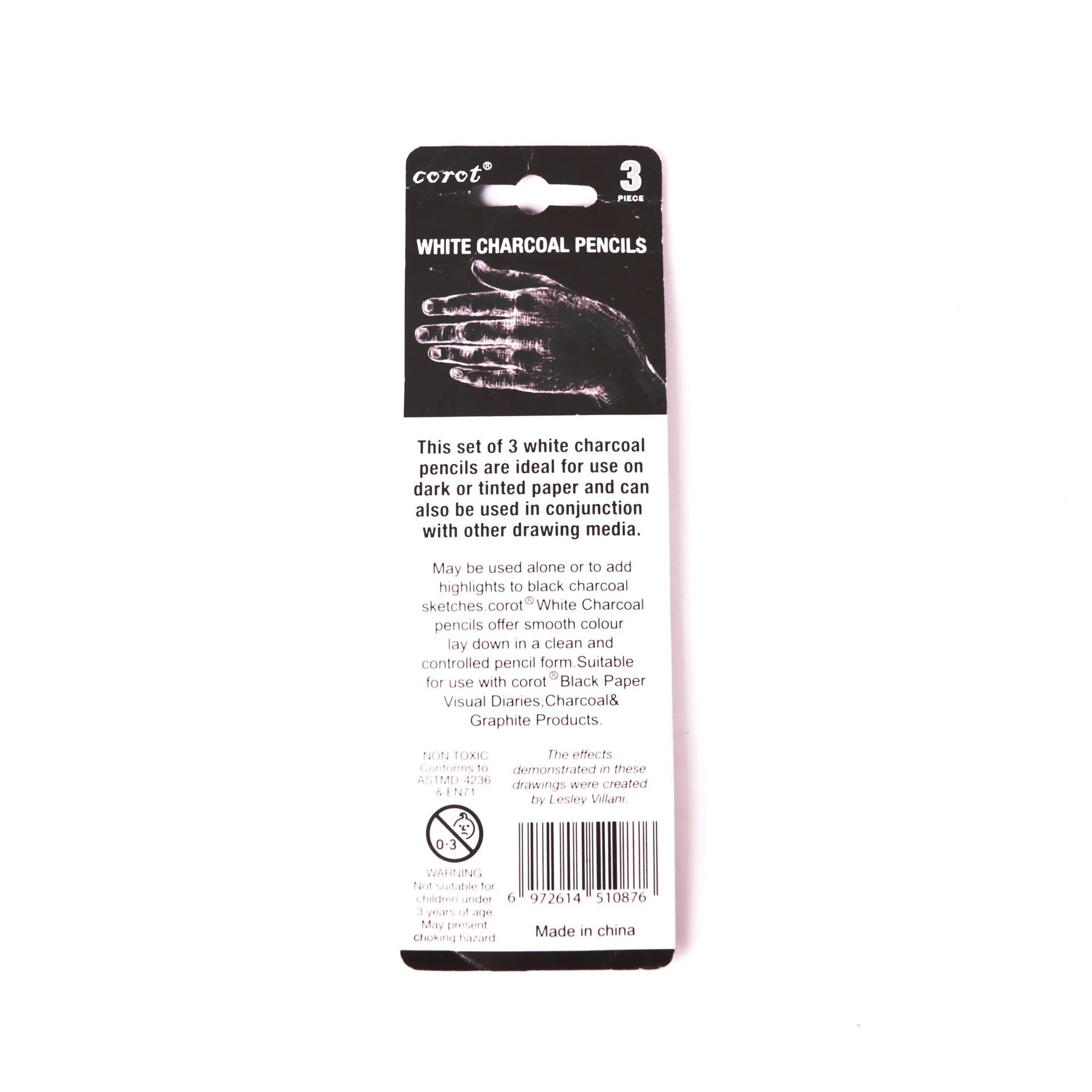 Three white charcoal pencils in wooden casings for drawing highlights on dark paper