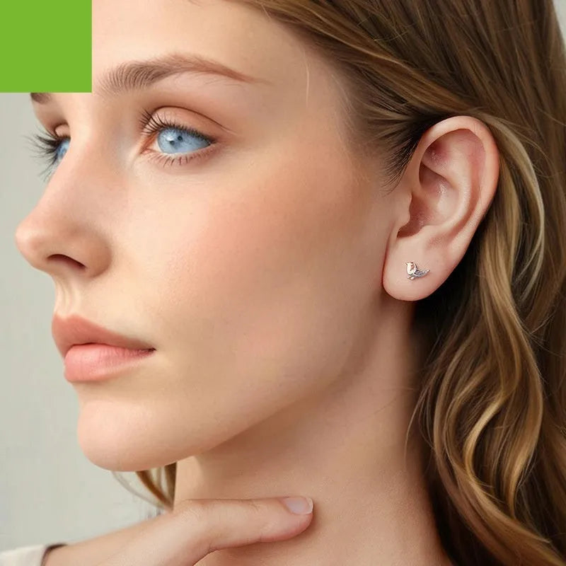 S925 sterling silver three-dimensional bird ear studs in colour SCE1944, supplied as a pair