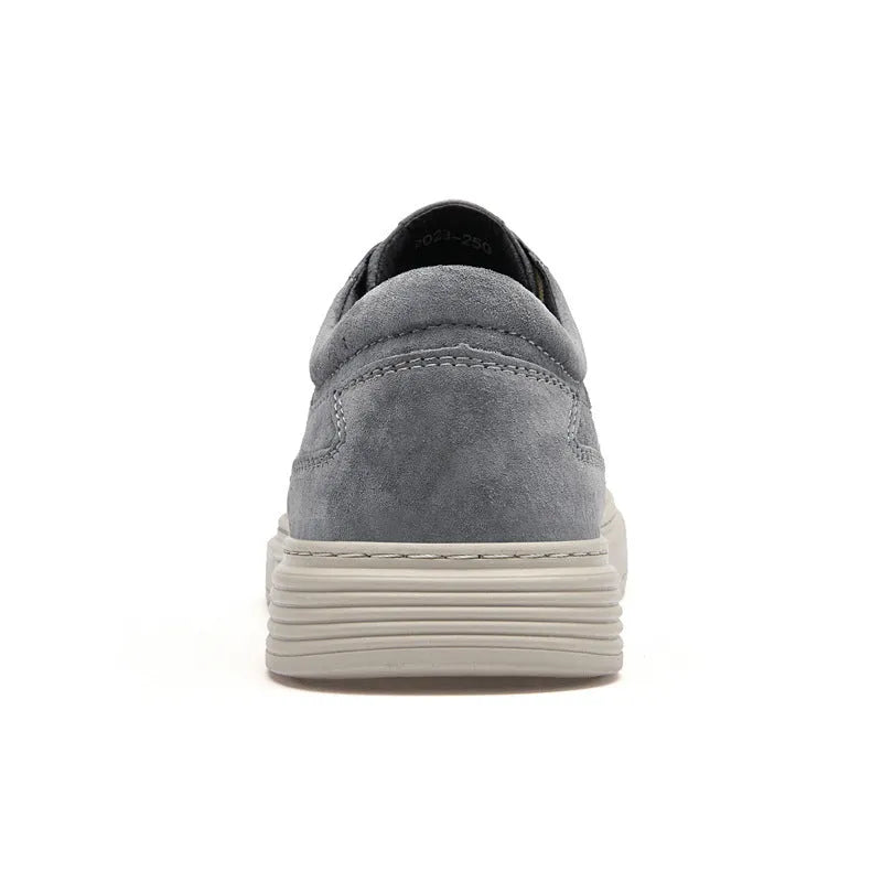 Men's grey casual skate shoes with pigskin upper and rubber sole on white background