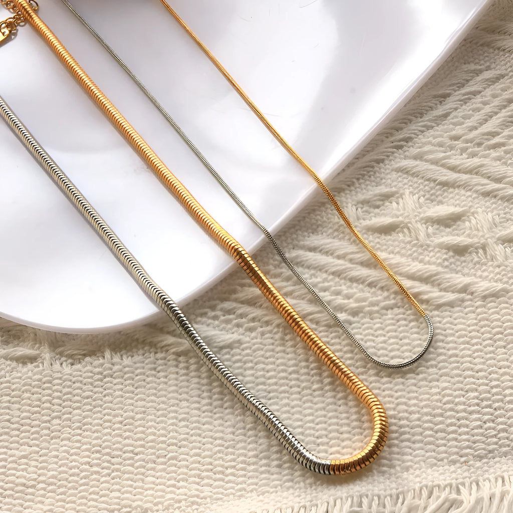 Women's stainless steel snake bones chain necklace with geometric design in gold colour