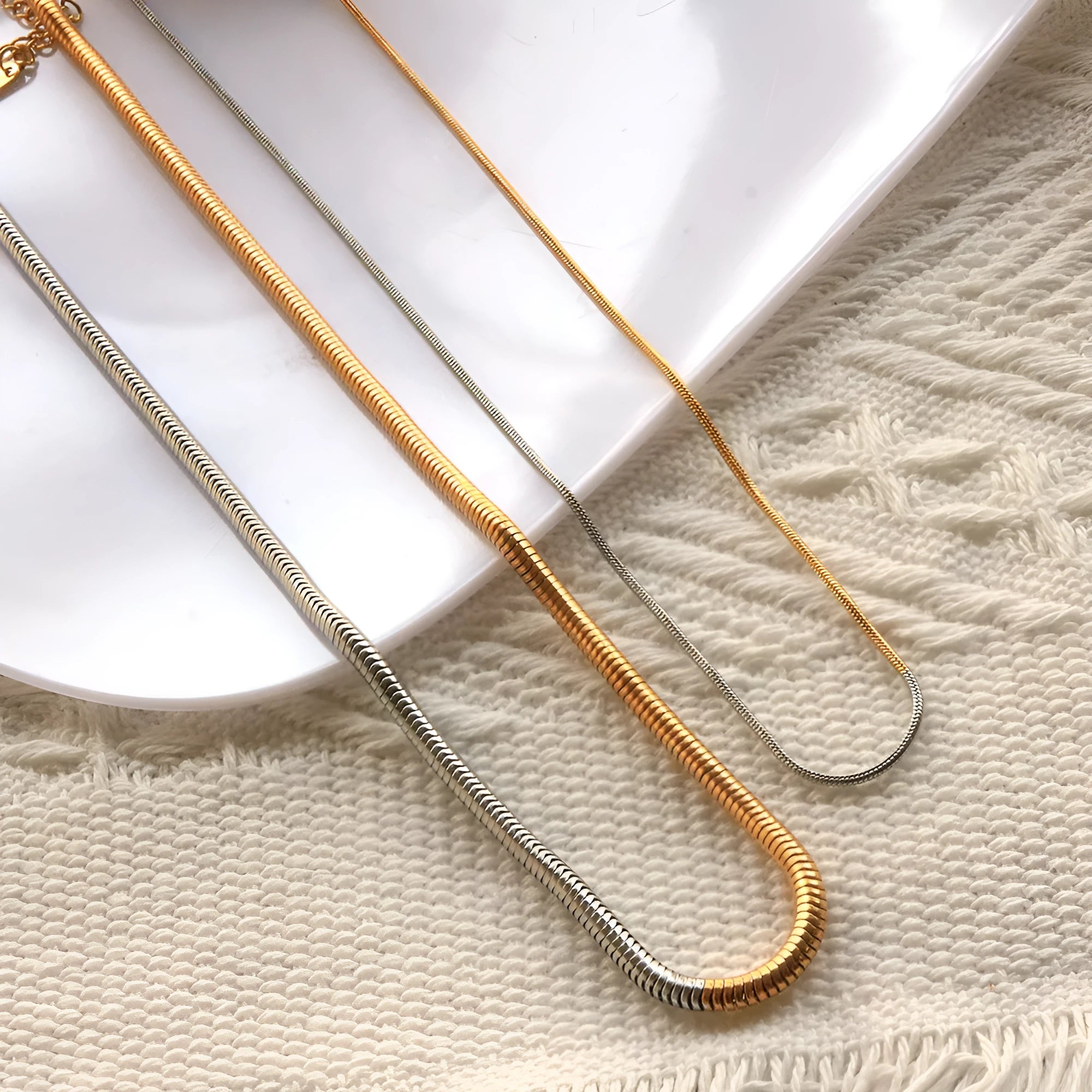 Women's stainless steel snake bones chain necklace with geometric design in gold colour