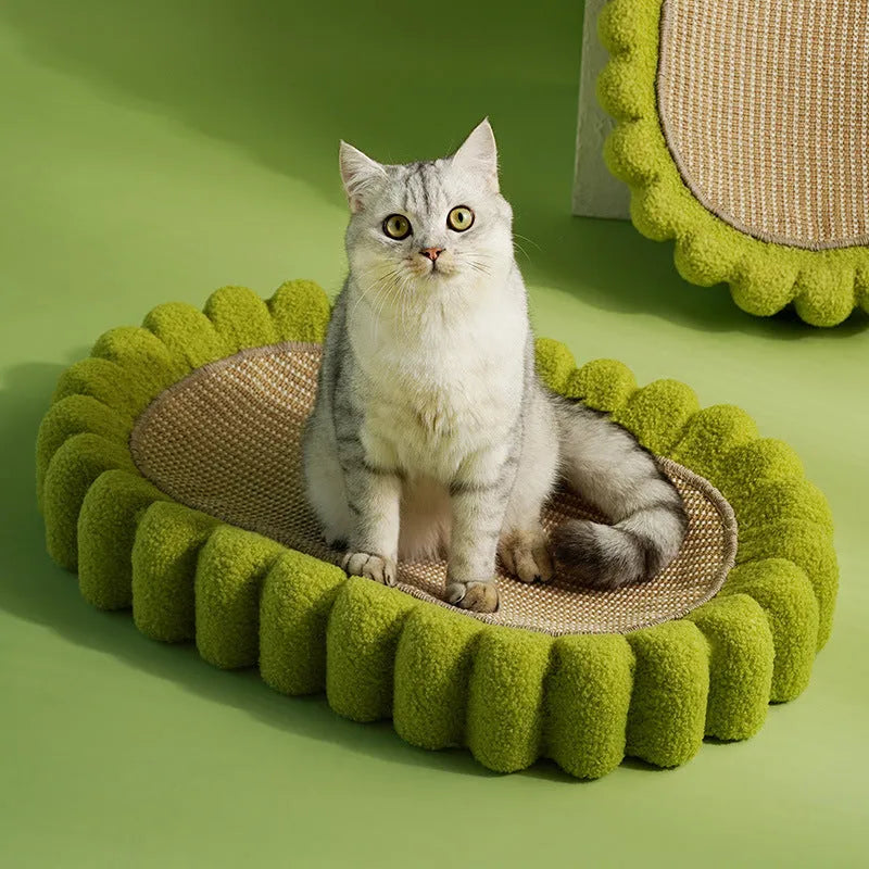 Green oval sisal cat scratcher pad bed measuring 650mm by 420mm