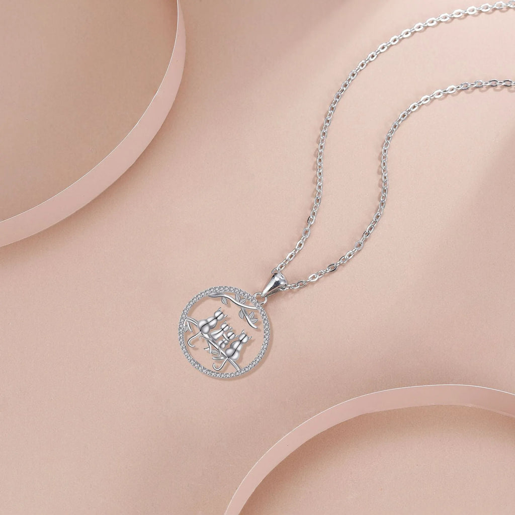 Copper necklace with four kitten pendant design and cross chain style
