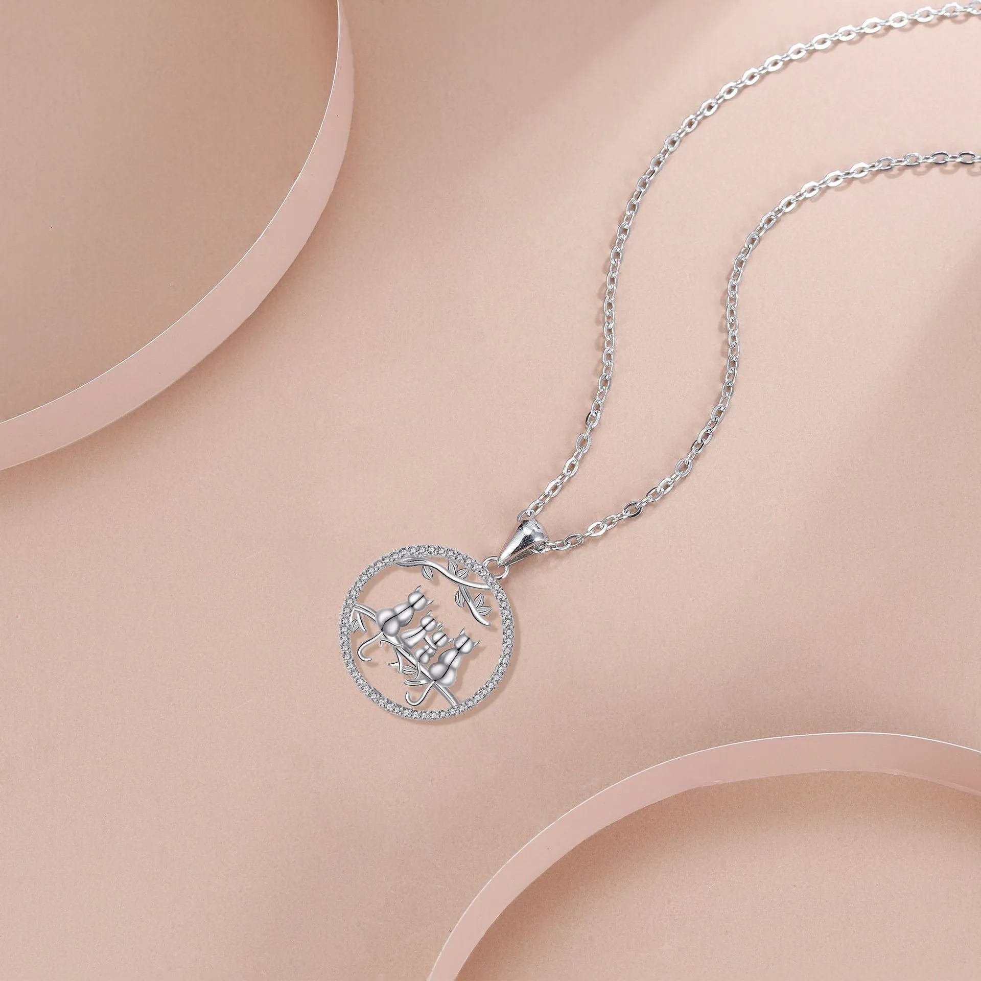 Copper necklace with four kitten pendant design and cross chain style