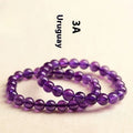 Natural amethyst Uruguay bracelet with scattered polished crystal beads on wrist