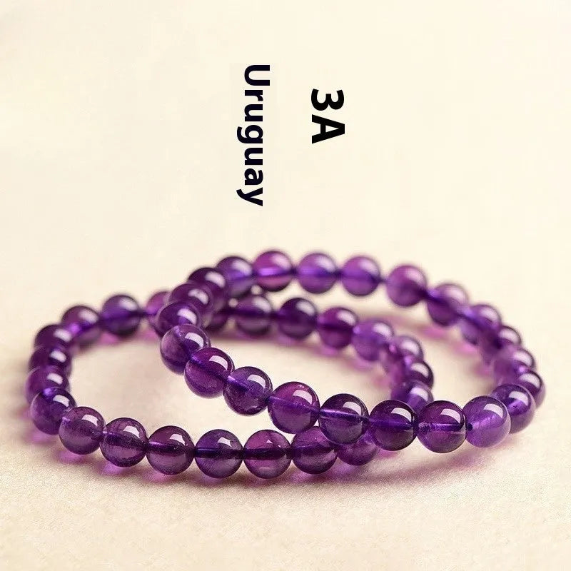 Natural amethyst Uruguay bracelet with scattered polished crystal beads on wrist
