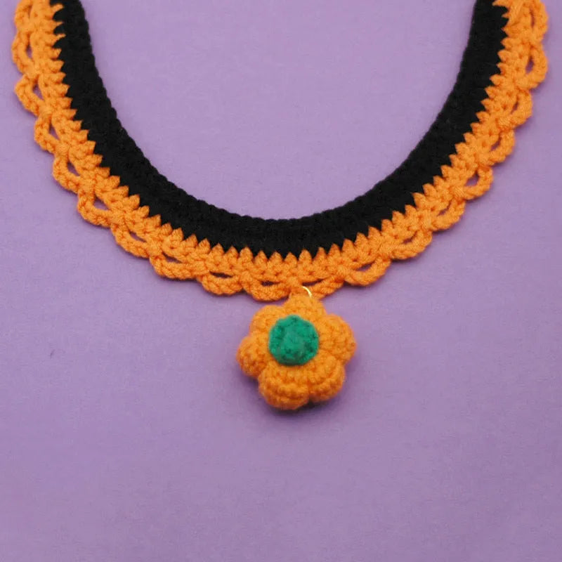 Hand-crocheted wool pet collar in pumpkin colours with adjustable sizing for Halloween photo accessories