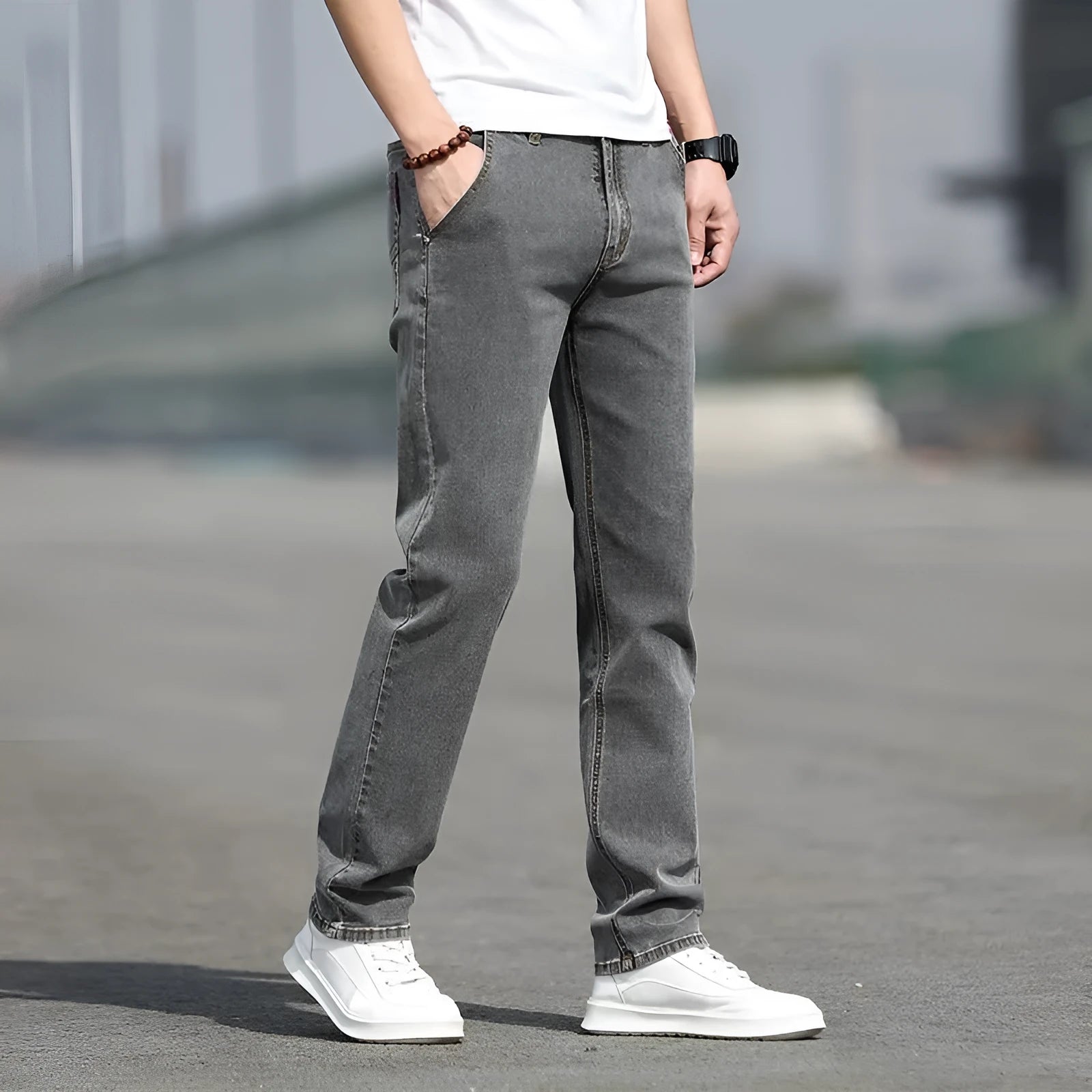 Man wearing smoky gray low-waist straight-leg jeans made from high-elasticity rabbit fur fabric.
