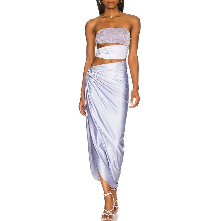 Purple one-piece swimsuit with matching wrap skirt on a mannequin, showing the tight fit and European/American styling.