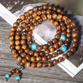 108 bead Lvzhu stone bracelet with 5-6mm geometric beads on wrist