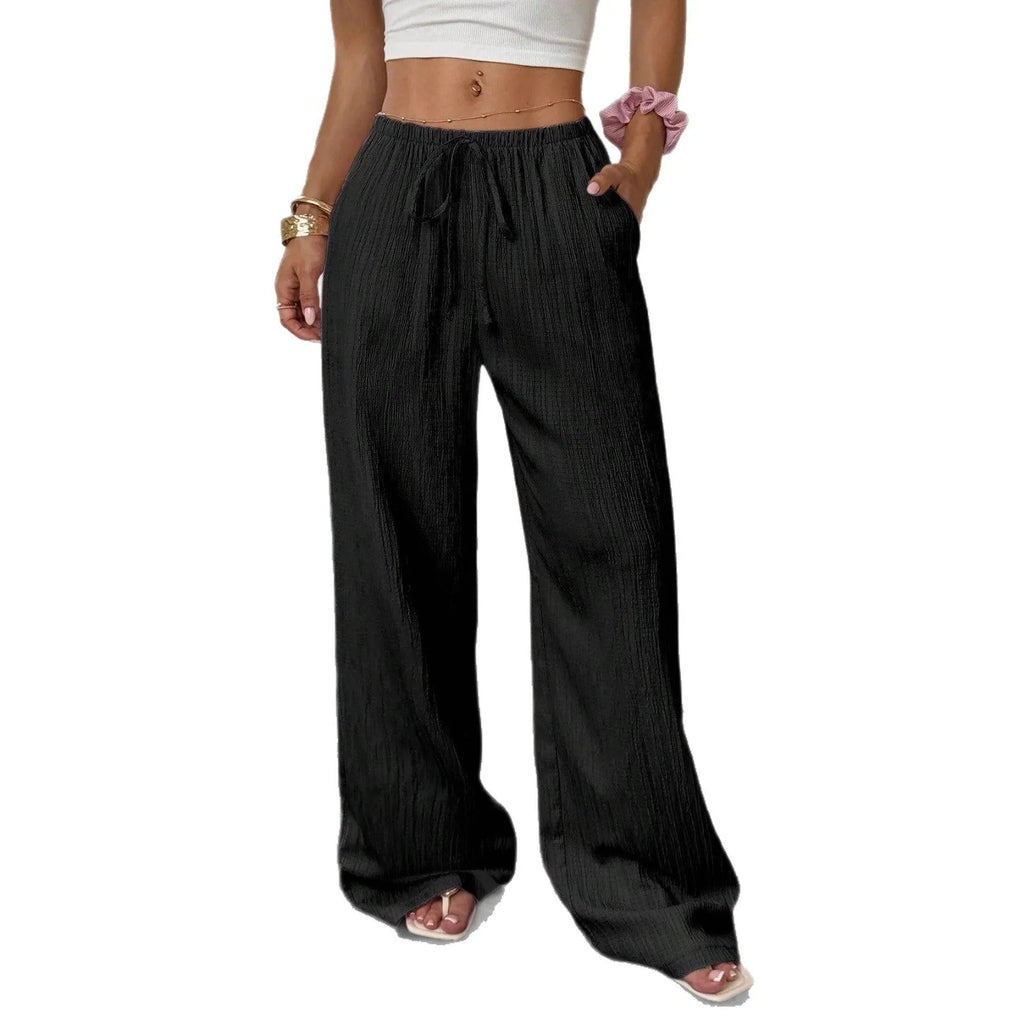 Women's black wide leg trousers with lace-up waist detailing on mid-rise waist