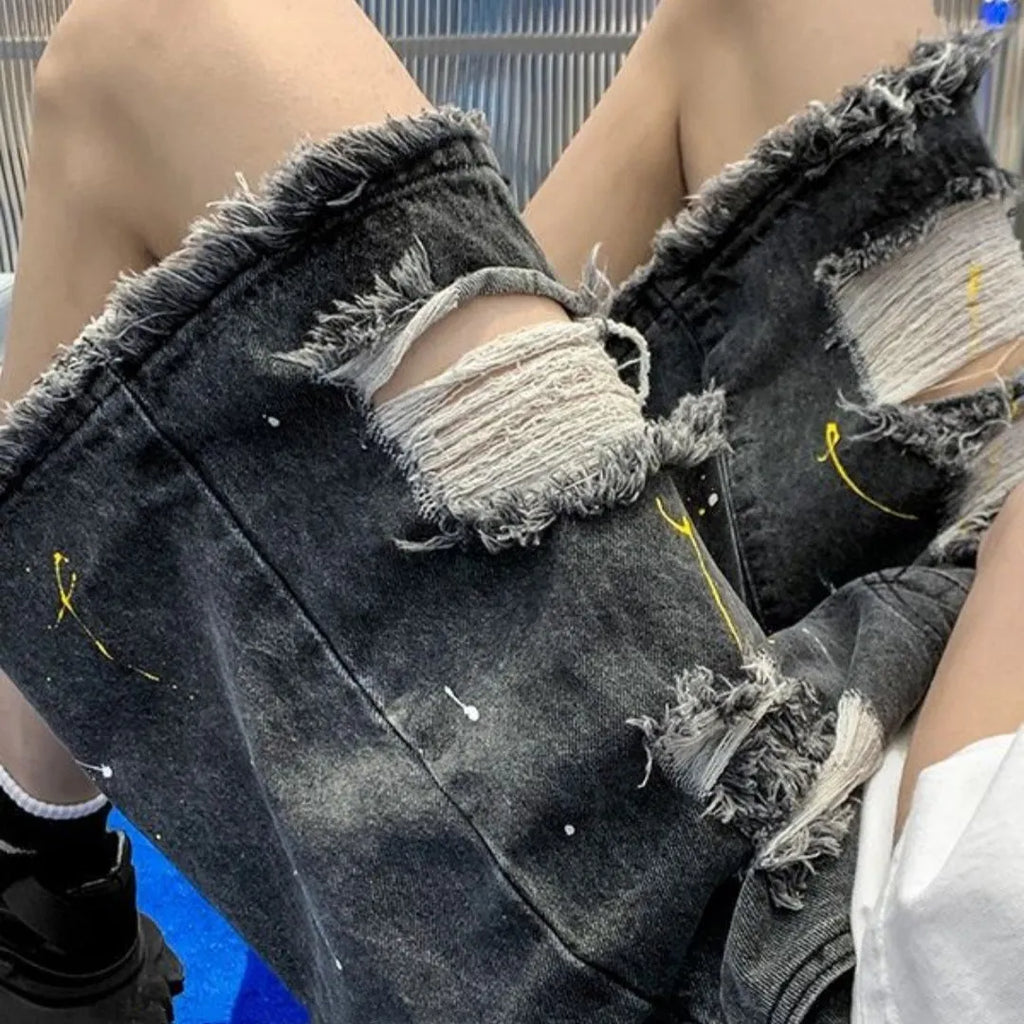 Men's loose fit denim shorts with water washed finish and distressed holes in light blue colour