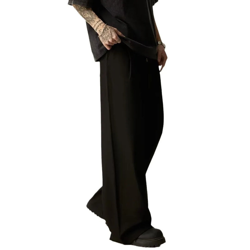 Men's black vertical tube wide-leg trousers showing cotton blend fabric texture and straight-leg silhouette