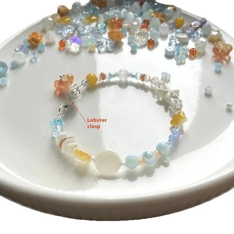 Orange alloy bracelet with diamond shape design and mixed materials for summer seaside wear