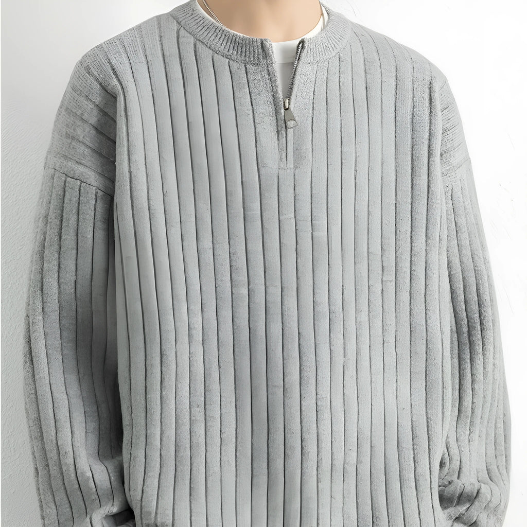 Men's grey half zip textured knit sweater showing loose fit design and adjustable zip closure