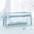 Transparent double-layer pencil case in blue showing interior compartments