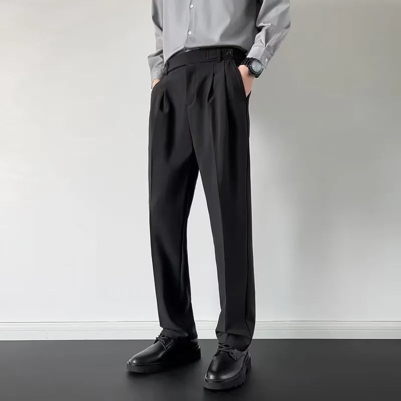 Apricot and black men's straight loose-fit suit trousers on a hanger.