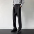 Apricot and black men's straight loose-fit suit trousers on a hanger.