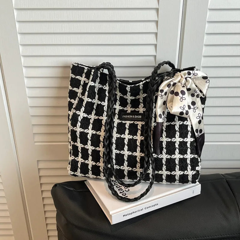 Black wool shoulder bag with horizontal square shape and internal organisation compartments