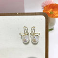 Pair of minimalist mermaid pearl earrings, each with a freshwater pearl drop on a gold-tone fish hook fitting, Style1