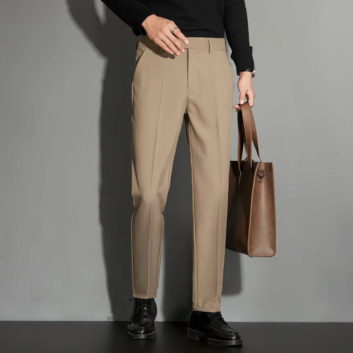 Men's straight leg suit trousers in chemical fibre blend fabric showing spring draping effect