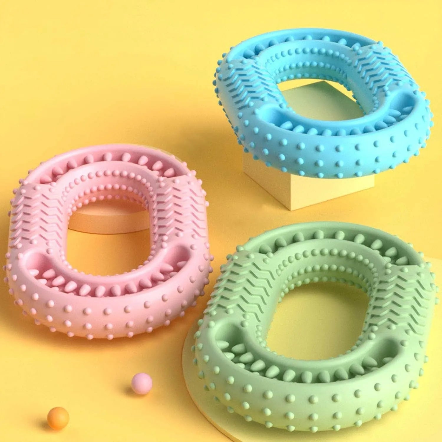 Blue green pink O-ring dog chew toy for aggressive chewers with dental benefits