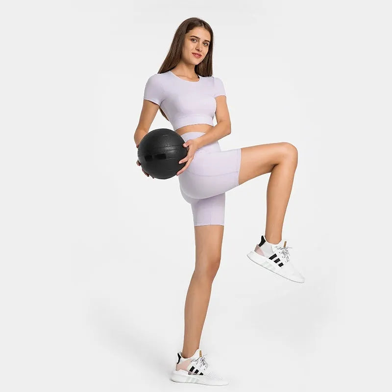 Woman wearing solid colour super stretch cotton blend sports shorts for running.
