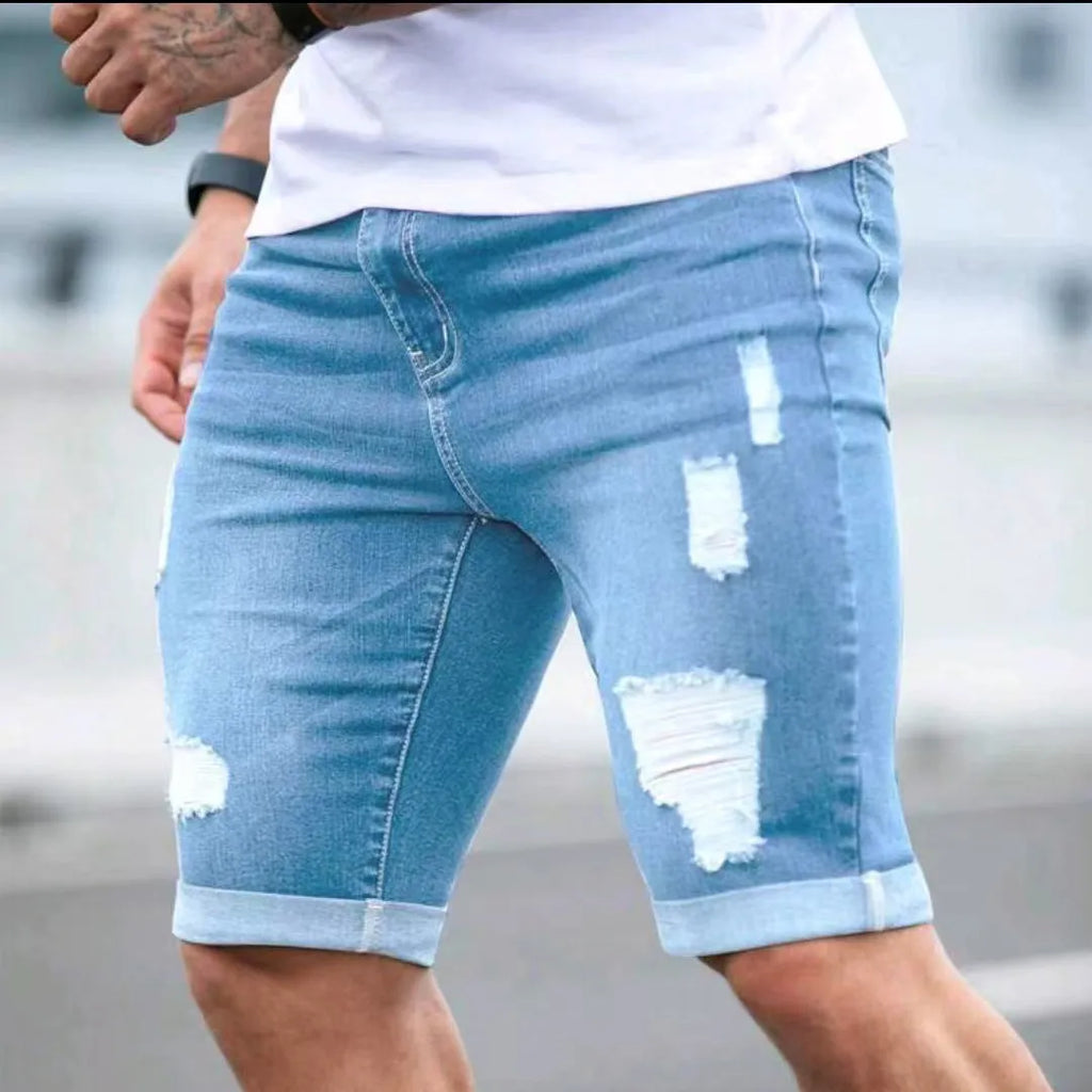 Sky blue men's denim shorts with multi-hole distressed design and low waist straight cut